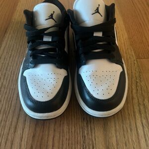 Woman’s Black and White Jordan ones